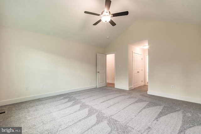 unfurnished bedroom with carpet flooring, ceiling fan, a closet, and vaulted ceiling