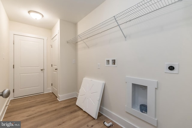 clothes washing area with hardwood / wood-style floors, hookup for a washing machine, and electric dryer hookup