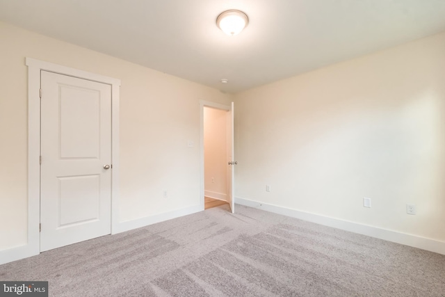 empty room with carpet flooring