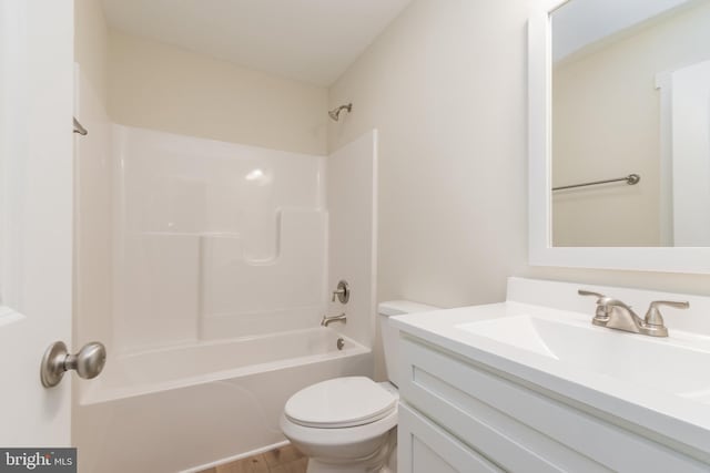 full bathroom featuring shower / tub combination, vanity, and toilet