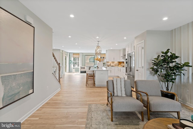 living room with light hardwood / wood-style floors