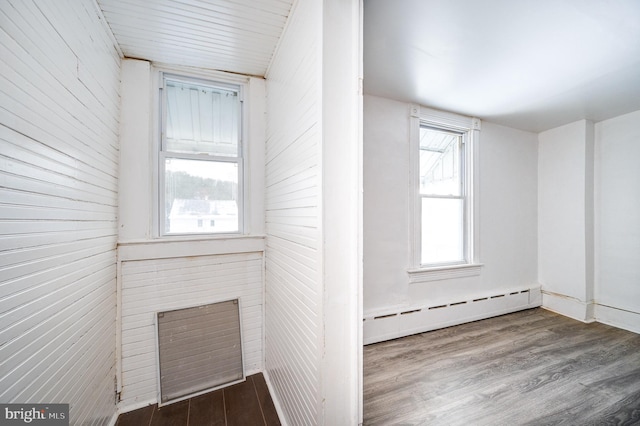 interior space featuring a baseboard radiator and dark wood-style flooring