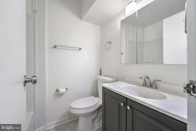 bathroom with tile patterned flooring, a shower, vanity, and toilet