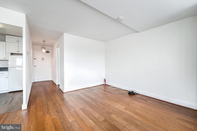 empty room with wood-type flooring