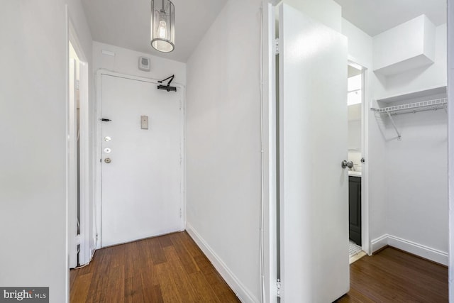 corridor featuring wood-type flooring