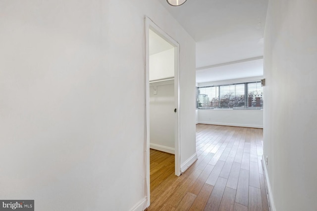 hall with light hardwood / wood-style floors