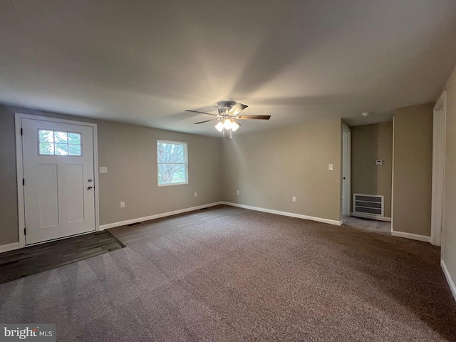 carpeted entrance foyer with ceiling fan