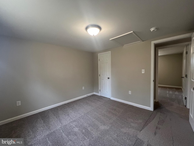 unfurnished bedroom featuring dark colored carpet