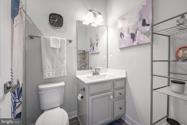 bathroom with vanity and toilet