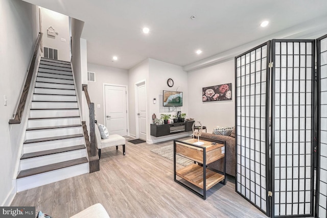 living room with light hardwood / wood-style floors