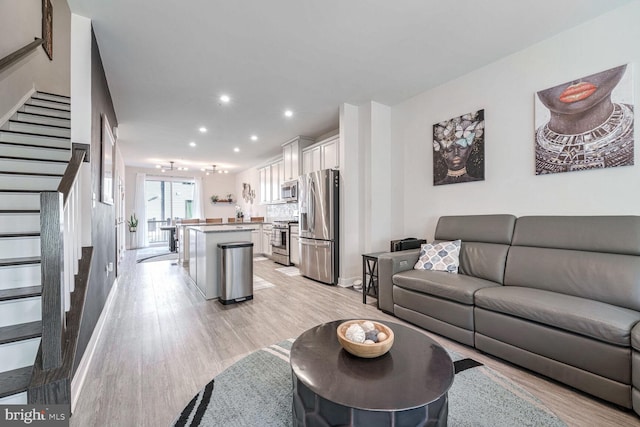 living room with light hardwood / wood-style floors