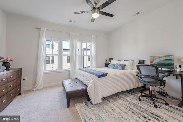 bedroom featuring light carpet and ceiling fan