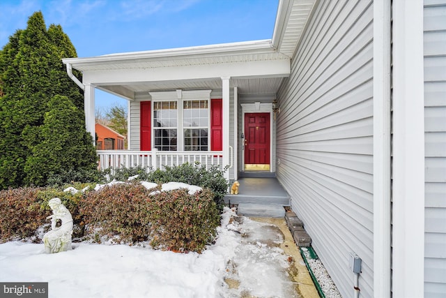 view of snow covered property entrance