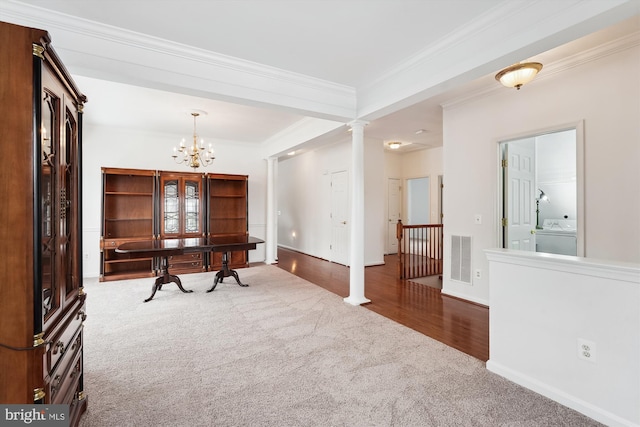 interior space featuring washer / dryer, crown molding, and a notable chandelier