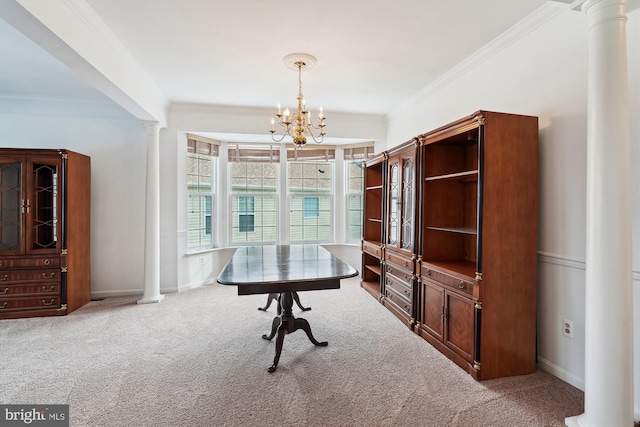 office area featuring carpet floors, ornate columns, a chandelier, and ornamental molding