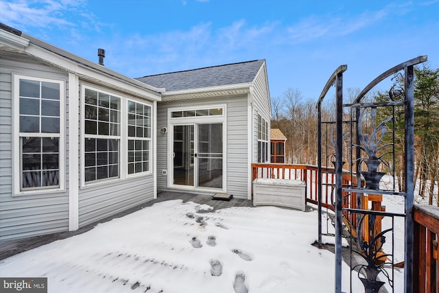 view of snow covered deck