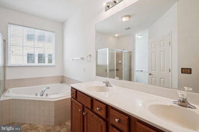 bathroom with vanity, tile patterned floors, and shower with separate bathtub