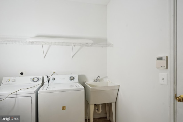 laundry room featuring sink and washing machine and dryer