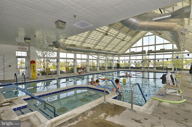 view of pool featuring a water view