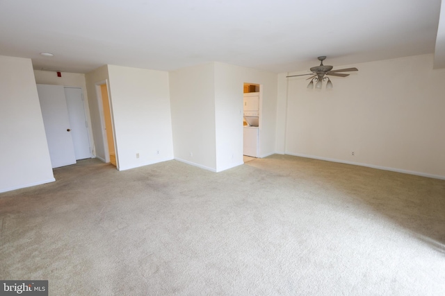 empty room with light colored carpet and ceiling fan