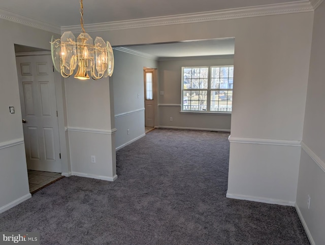 empty room with ornamental molding, dark colored carpet, a chandelier, and baseboards