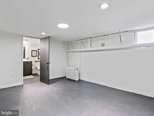 basement with radiator heating unit