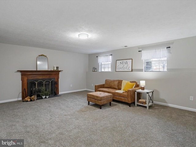 carpeted living room featuring a textured ceiling