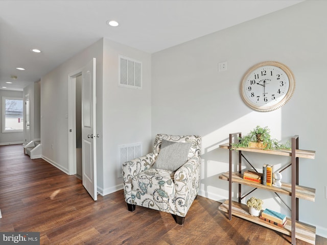 sitting room featuring dark wood-type flooring