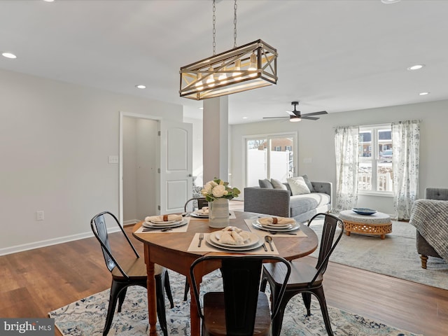 dining area featuring ceiling fan, wood-type flooring, and a wealth of natural light