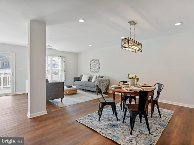 dining space with dark wood-type flooring