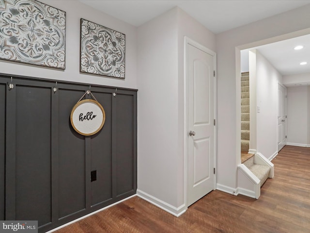 entryway with hardwood / wood-style floors