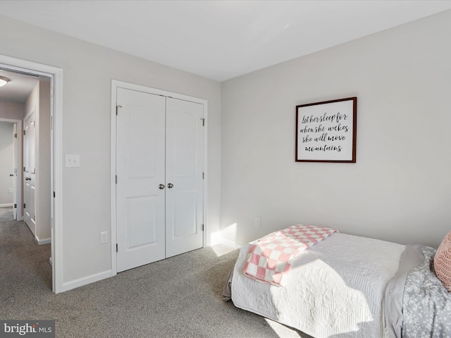 carpeted bedroom featuring a closet