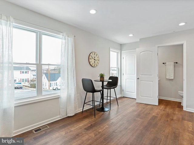 dining room with dark hardwood / wood-style floors