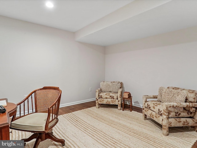 sitting room with hardwood / wood-style flooring