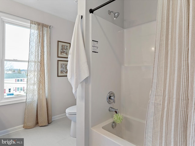 bathroom featuring shower / bath combination with curtain, toilet, a water view, and a healthy amount of sunlight