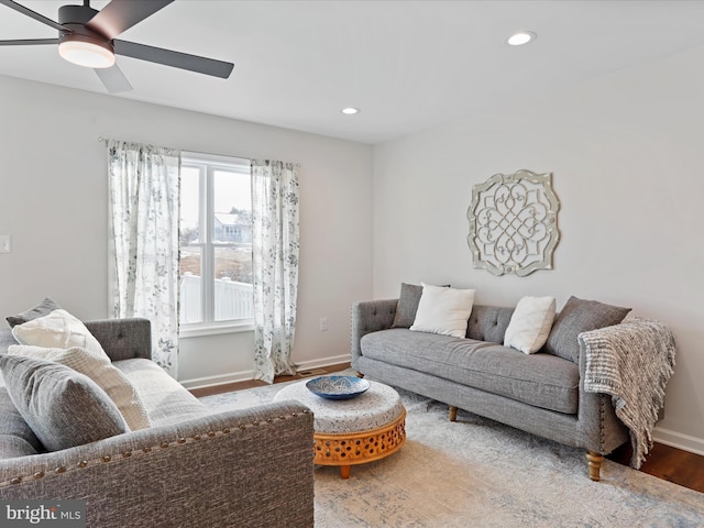 living room with ceiling fan and wood-type flooring