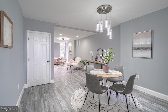 dining space featuring hardwood / wood-style floors