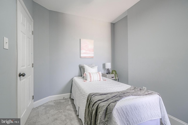 bedroom with light colored carpet