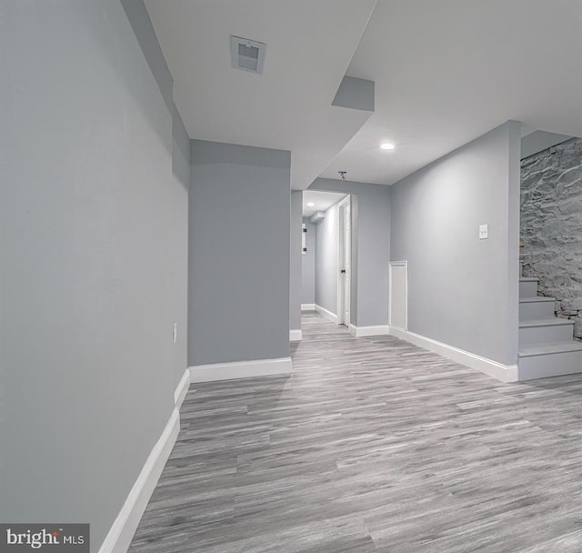 basement featuring light wood-type flooring