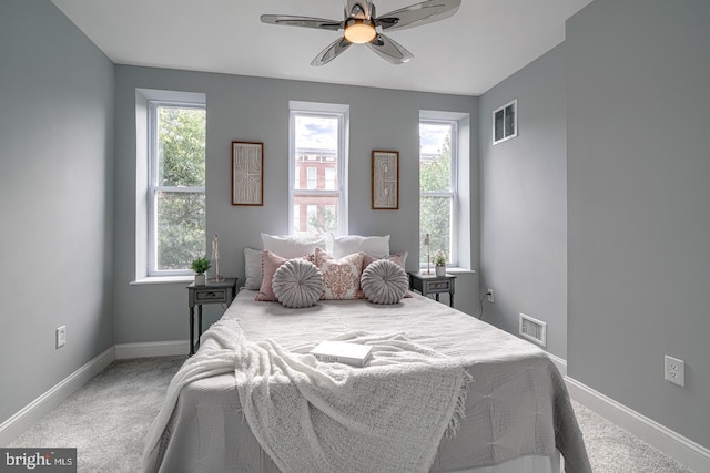 carpeted bedroom with ceiling fan