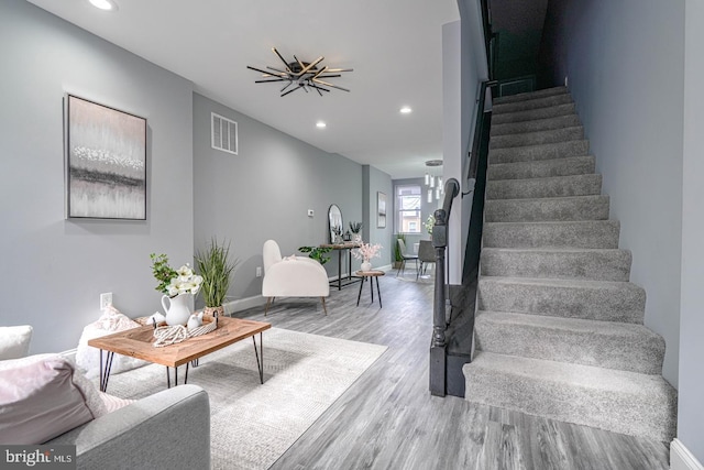 stairway with hardwood / wood-style floors