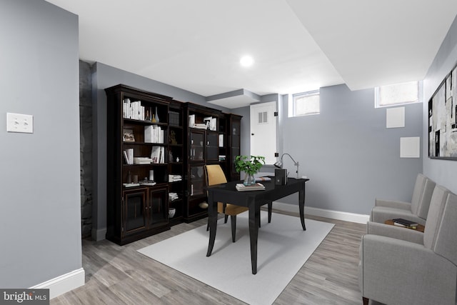 home office with light wood-type flooring