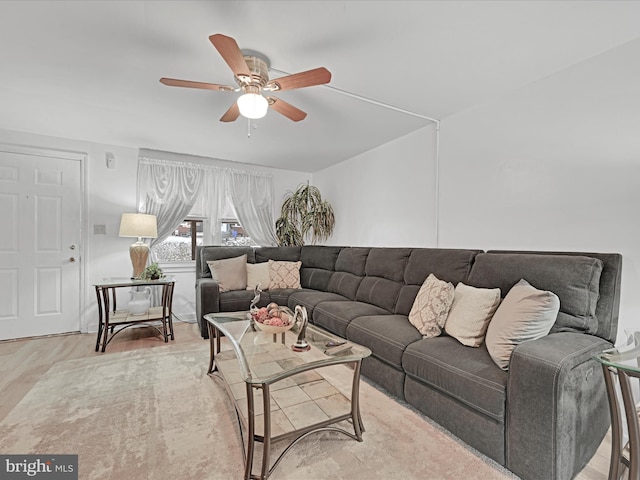 living room featuring light wood-type flooring and ceiling fan