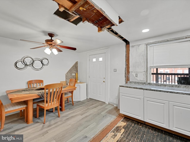 dining space featuring ceiling fan and light hardwood / wood-style floors