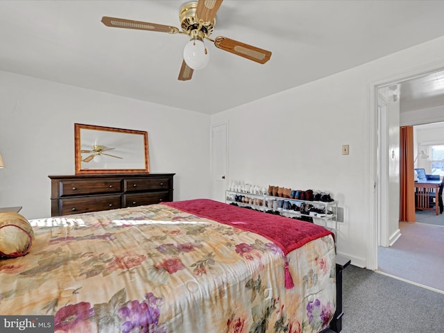 carpeted bedroom with ceiling fan