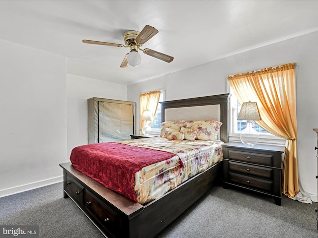 bedroom with dark colored carpet and ceiling fan