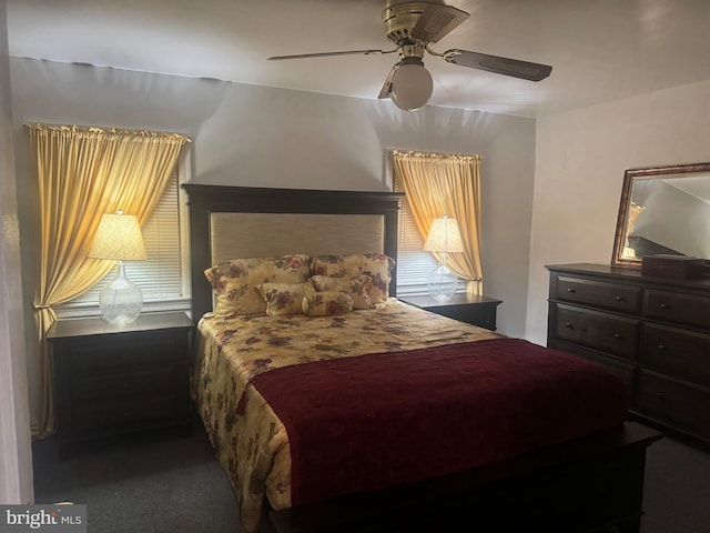 bedroom with ceiling fan and carpet floors