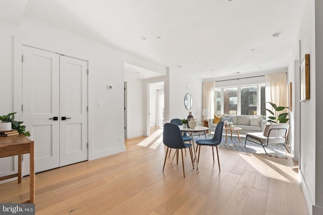 dining space featuring light hardwood / wood-style floors