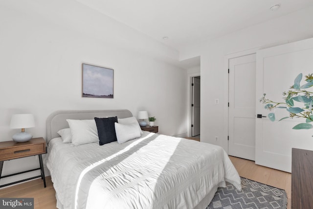 bedroom with hardwood / wood-style floors