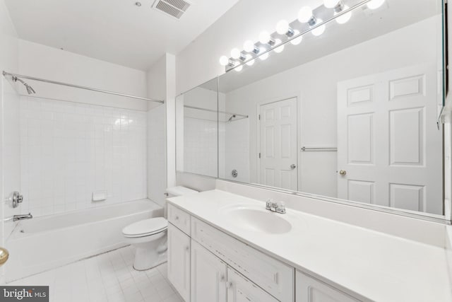 full bathroom featuring tile patterned floors, vanity, toilet, and tiled shower / bath